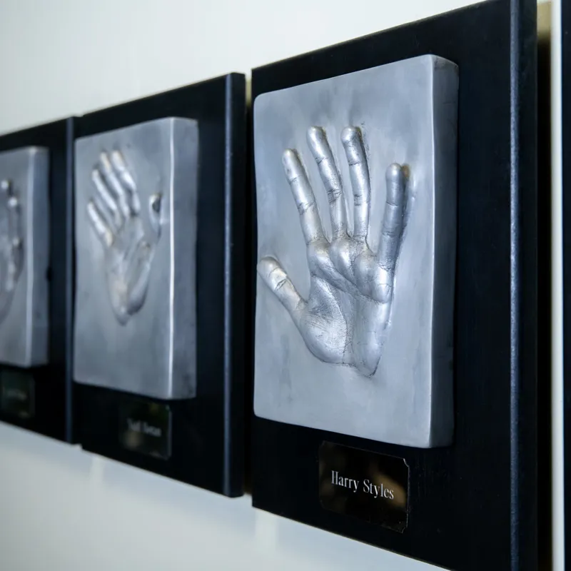 One Direction's handprints displayed at Madame Tussauds London's 1835 Champagne Bar.