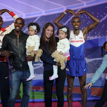 Mo Farah and his family with his figure at Madame Tussauds